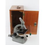 A Beck London Diamax 44278 microscope in wooden carry case having drawer pulling out to reveal