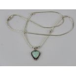 A 925 silver and opal pendant in the form of a heart on a Native American style beaded chain.