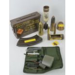 A quantity of inert brass shell casings, fuse head, mark III sten magazine, cartridge case, etc.