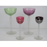 A matched pair of delightful coloured glass hock glasses 20cm high, in purple and green,