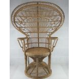 A wicker work 'peacock' chair.