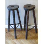 A pair of 1960s black forest type high tripod stools,