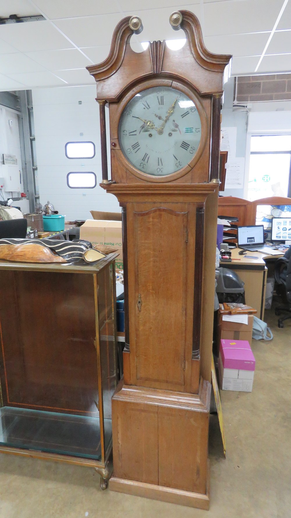 An oak crossbanded eight day long case clock, circular dial inscribed 'Mason,