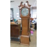 An oak crossbanded eight day long case clock, circular dial inscribed 'Mason,