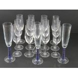 A set of thirteen Stolzle Champagne flutes together with a set of three Champagne flutes having