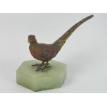 A cold cast bronze sculpture of a pheasant raised over marble base, 11cm wide, slightly a/f to tail.
