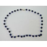 A lapis lazuli bead necklace having 925 silver clasp and measuring 41.5cm in length.