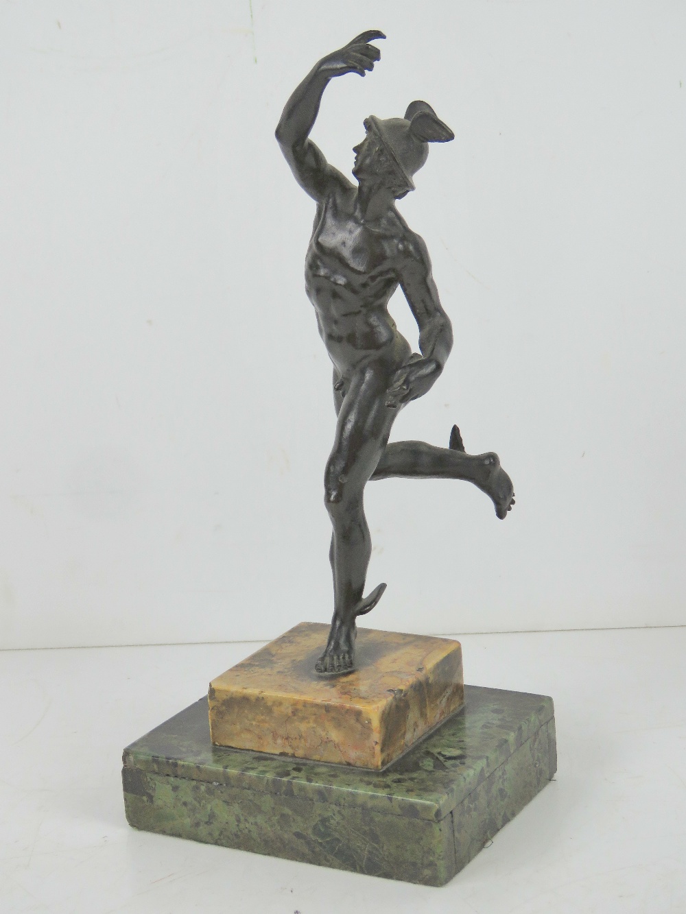 A cast metal sculpture of Hermes raised over marble base, all standing 25cm high. - Image 2 of 4