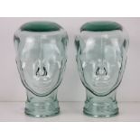 Two heavy glass 'mannequin' display heads, approx 30cm high.