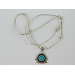 A 925 silver and opal pendant of geometric form on a Native American style beaded chain.