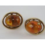 A pair of 9ct gold and Baltic amber earrings, hallmarked 375, with butterfly backs, 1.1cm wide.
