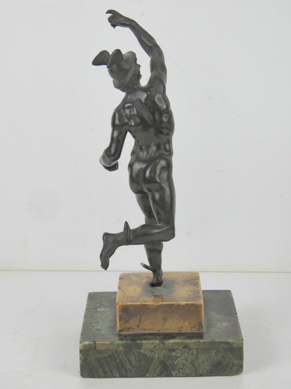 A cast metal sculpture of Hermes raised over marble base, all standing 25cm high. - Image 3 of 4