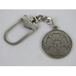 An HM silver key chain having Tudor Rose design upon, 26.3g.