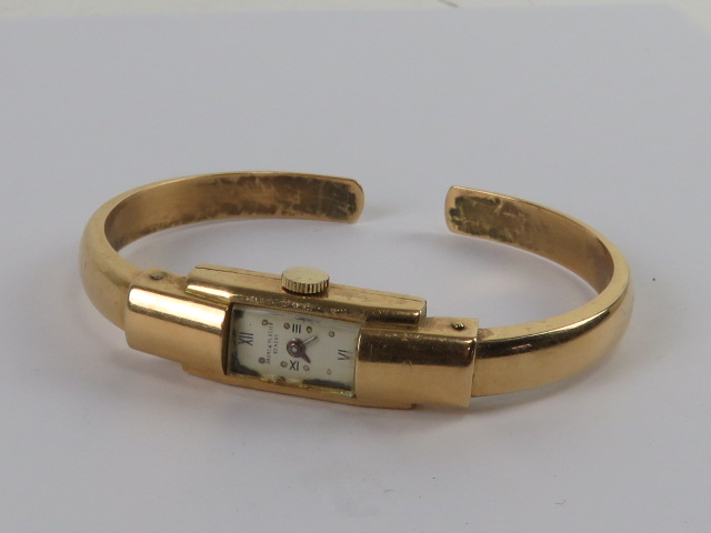 An 18ct gold Baume & Mercier hinged bangle wristwatch c1970s, hallmarked 750,