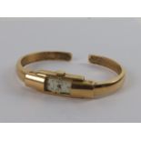 An 18ct gold Baume & Mercier hinged bangle wristwatch c1970s, hallmarked 750,