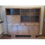 A good Art Deco offset cabinet comprising open shelf,