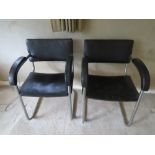 A pair of c1960s aluminium framed (retro) chairs with black leatherette upholstery.