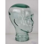 A heavy glass 'mannequin' display head, approx 30cm high.