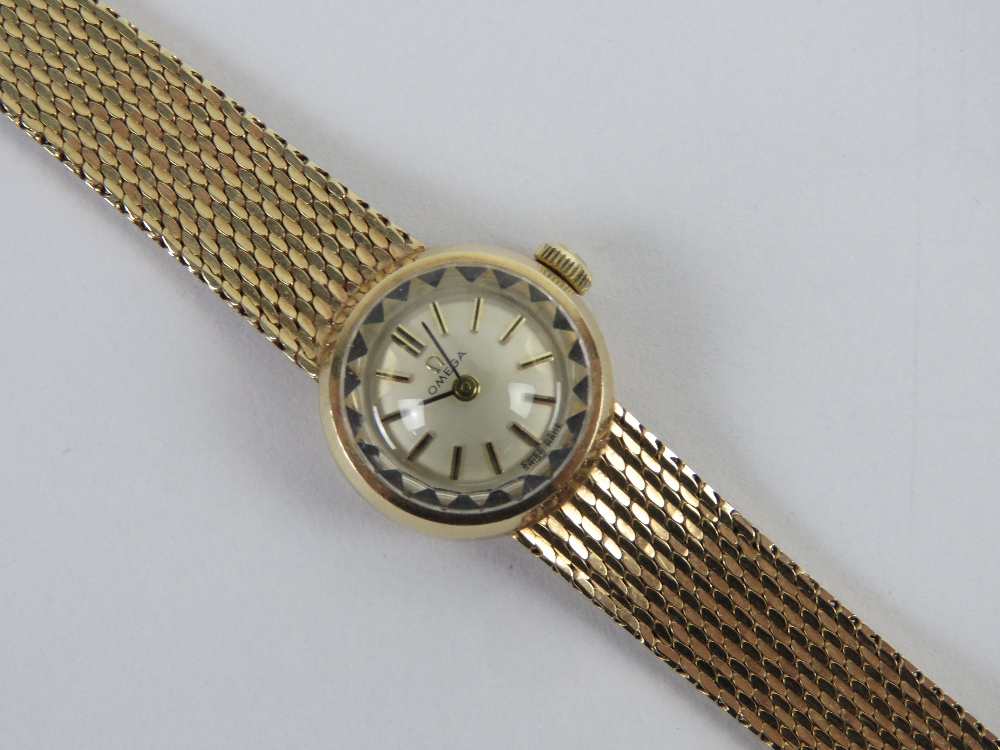 A 9ct gold ladies Omega cocktail wristwatch on integral strap, hallmarked 375,