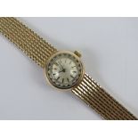A 9ct gold ladies Omega cocktail wristwatch on integral strap, hallmarked 375,