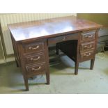 A c1930s mahogany rigid kneehole desk,