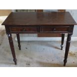 A 19th century twin drawer side table raised over reeded legs, 94 x 47 x 75cm.