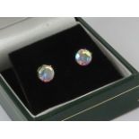 A pair of stud earrings, 9ct gold butterfly backs, claw set multi colour stone. In presentation box.