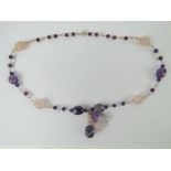 A rose quartz and amethyst agate necklace having silver beads and 925 silver clasp.