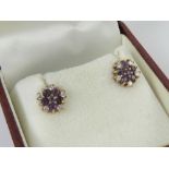 A pair of 9ct gold amethyst cluster stud earrings, hallmarked 375,