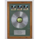 A framed record montage for The Beatles