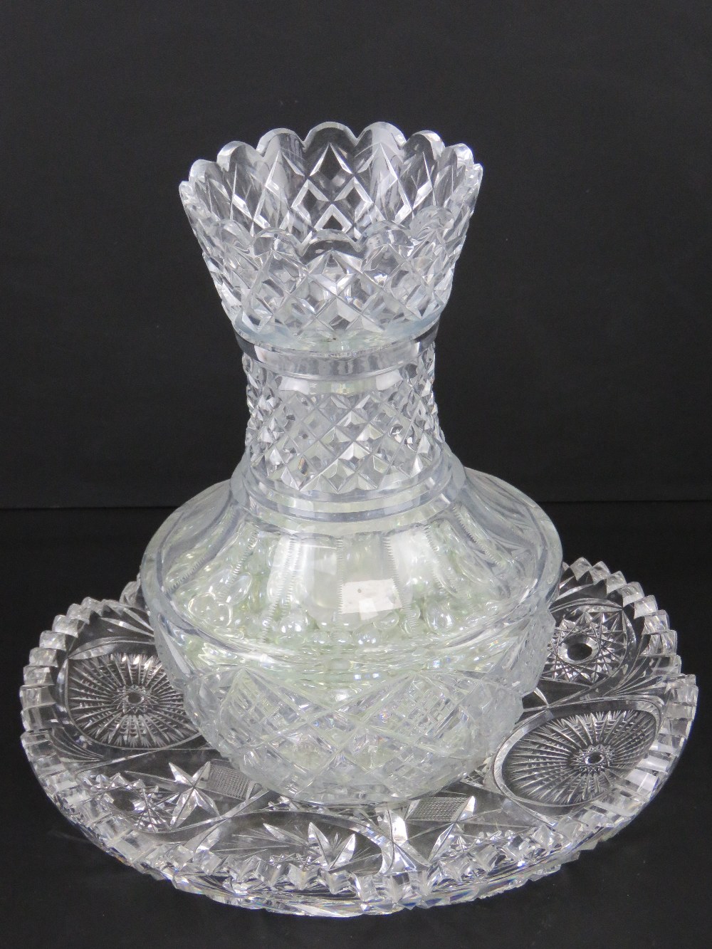 A lead crystal heavy cut glass two secti