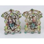 A pair of lattice ware ceramic figural g