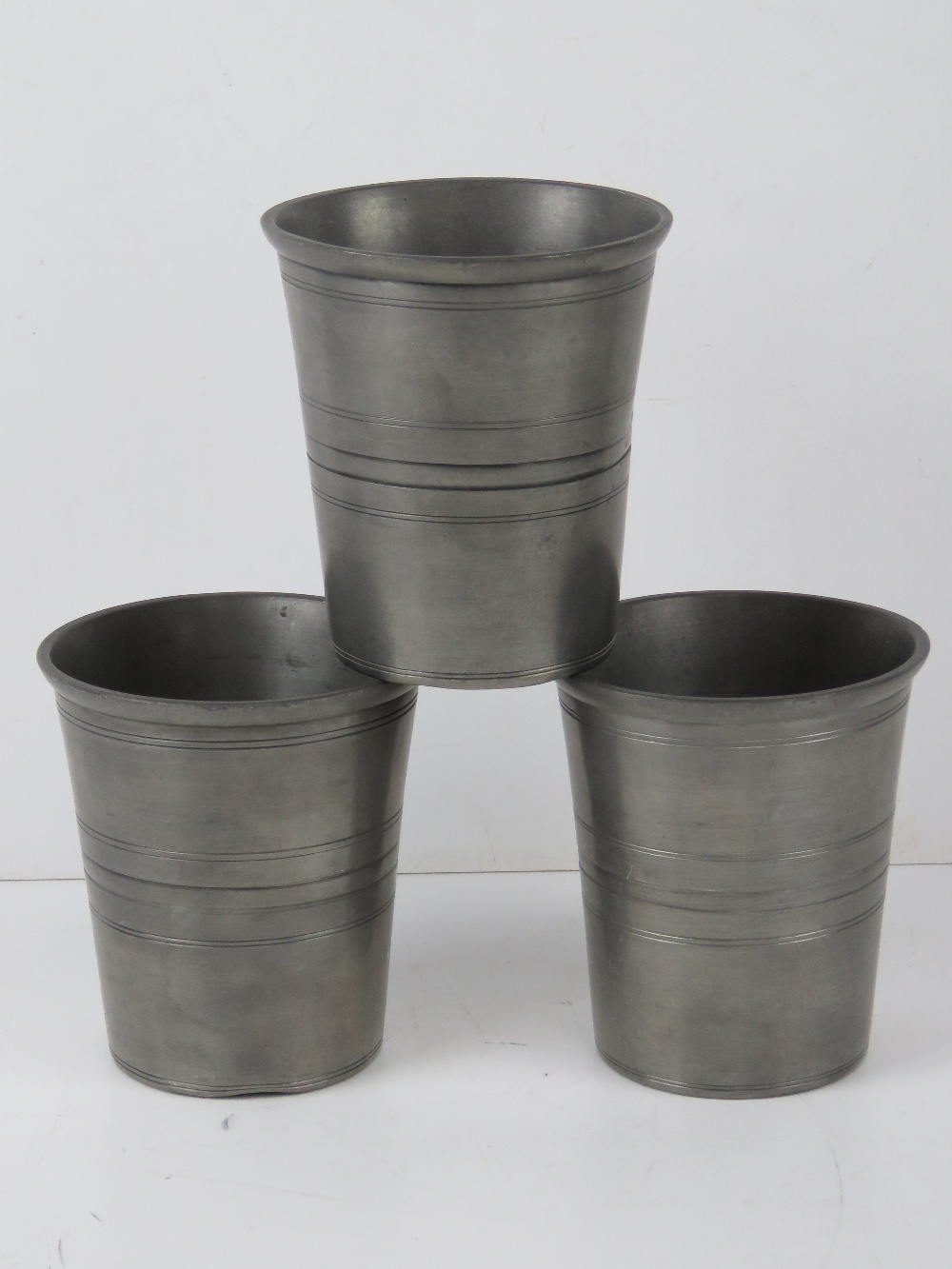 Three German pewter cups having Stuttgar