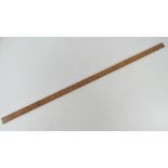 A boxwood yard stick having brass ends m