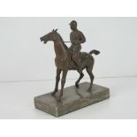 A cold cast bronze sculpture of jockey o