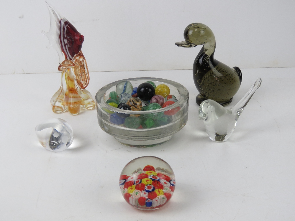 A quantity of glass paperweights two in