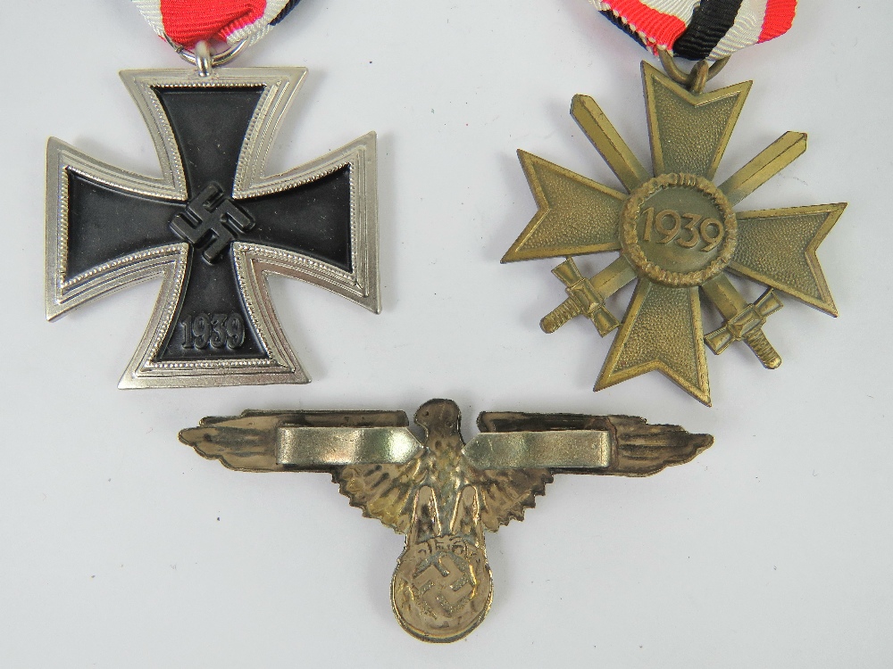Two reproduction WWII German medals, together with a reproduction badge. Three items. - Image 3 of 3
