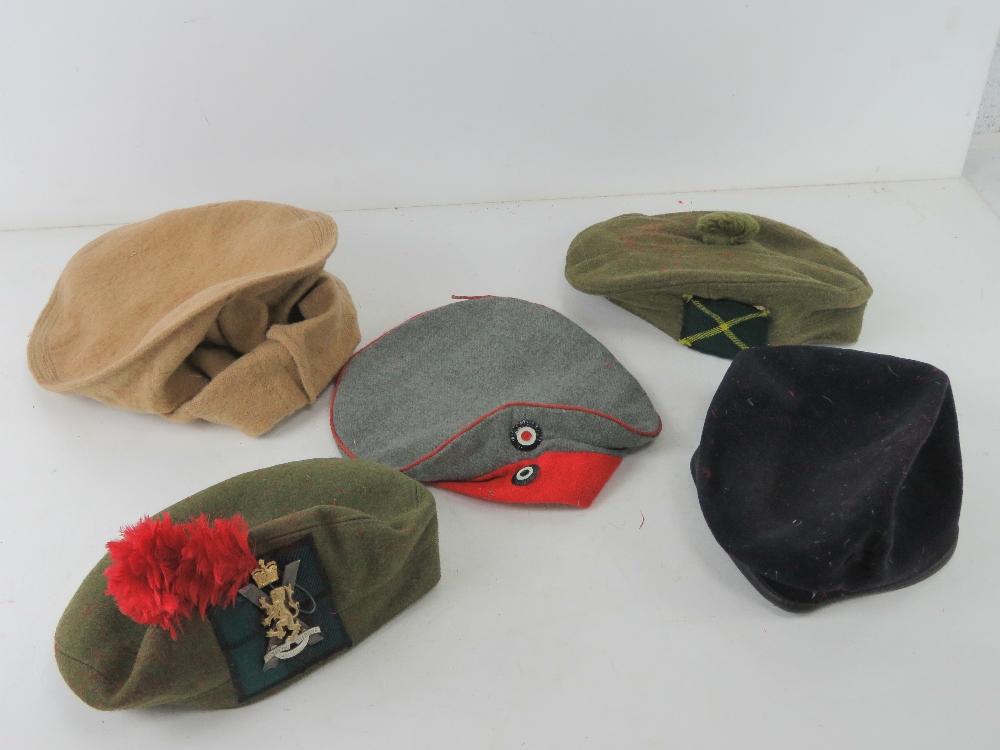 Five assorted military caps.