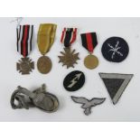 A quantity of assorted reproduction patches, medals and dress dagger knot.