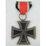A reproduction WWII German Iron Cross with ribbon.