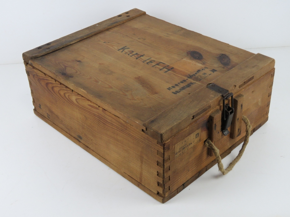 A German LEFH wooden ammunition crate with handle and labels. Dated 1944.