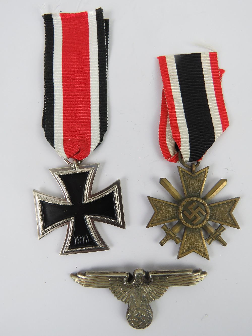 Two reproduction WWII German medals, together with a reproduction badge. Three items. - Image 2 of 3