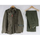 A replica WWII German Combat Tunic and Trousers (XL).