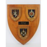 A presentation Plaque for Royal Corp of Transport having three small plaques attached.