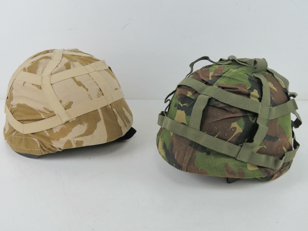 A British Cadet helmet with desert camo and another with DPM camo. Two items.