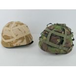 A British Cadet helmet with desert camo and another with DPM camo. Two items.