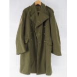 A British Army Great coat dated 1951, badged to REME, size 9.