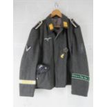 A reproduction WWII German Luftwaffe Tunic with insignia and side cap (size 58).
