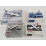 Four 1/200 scale model aircraft by Herpa