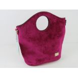 A fushia velvet handbag by Bessie London, having original tags upon, no shoulder strap.